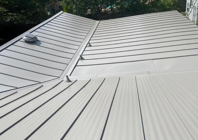 Solar attic fan installed on a metal roof for Roof Ventilation in Safety Harbor